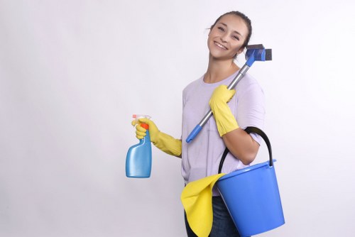 Barnes Cleaners staff handling garments with care in a professional laundry setting